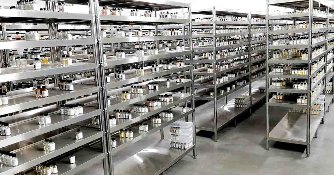Organized flavor reference samples stored on stainless-steel laboratory shelving